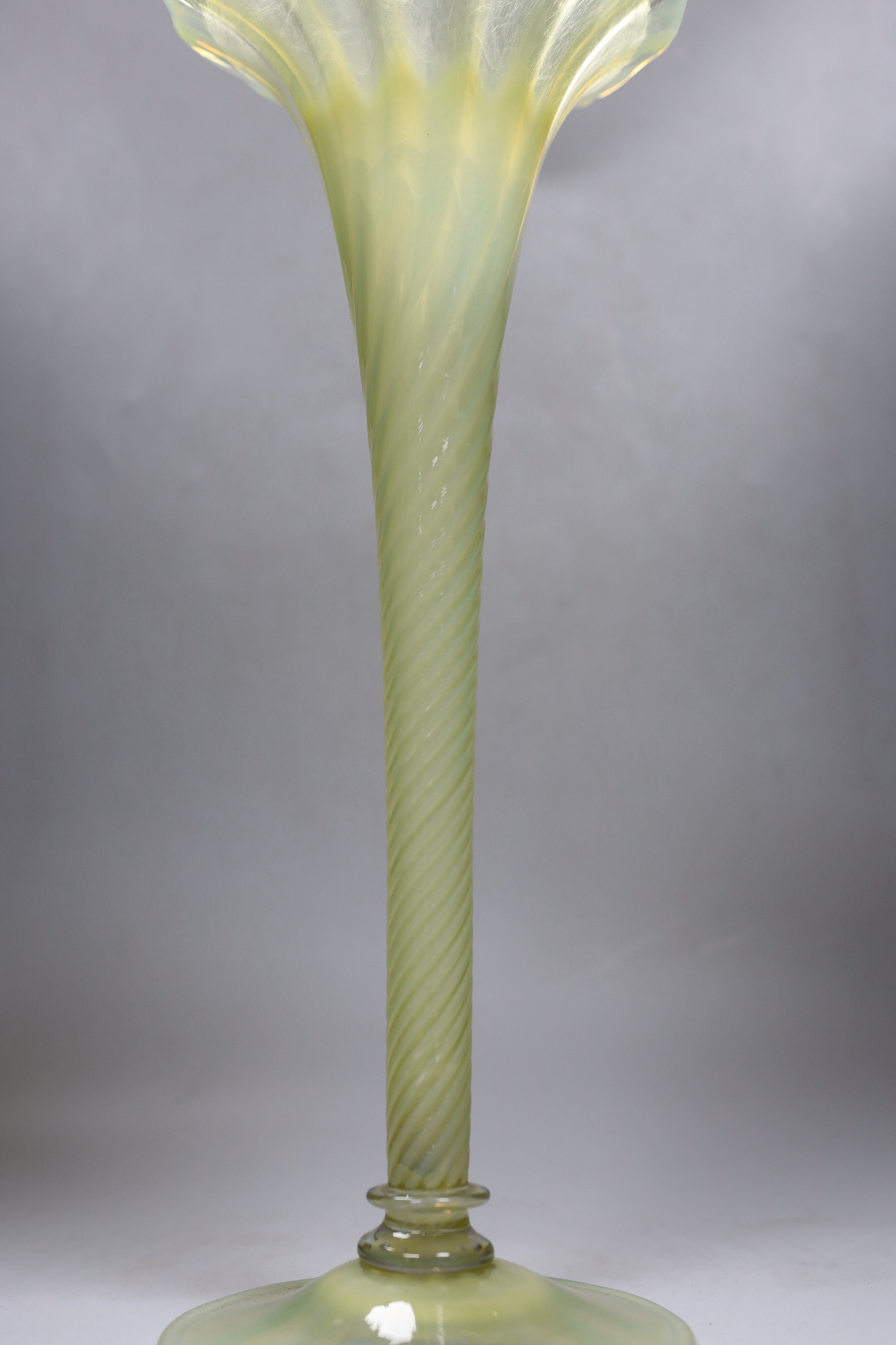 An early 20th century Vaseline glass vase, 41cm tall